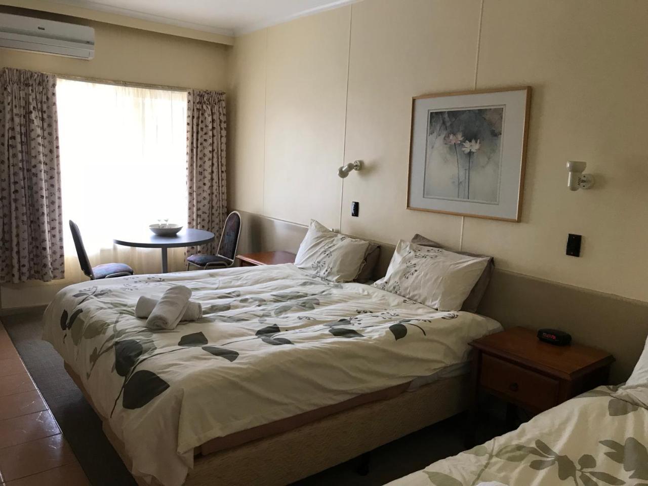 Queen Bed and Single (Non - Pet Room)
